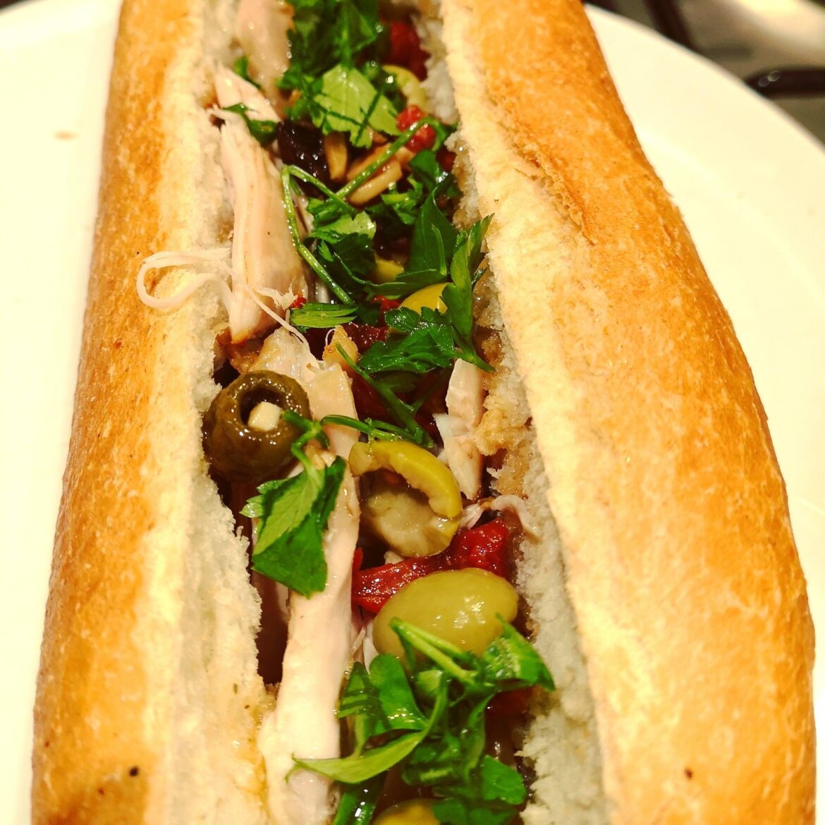 Chicken Marbella baguette