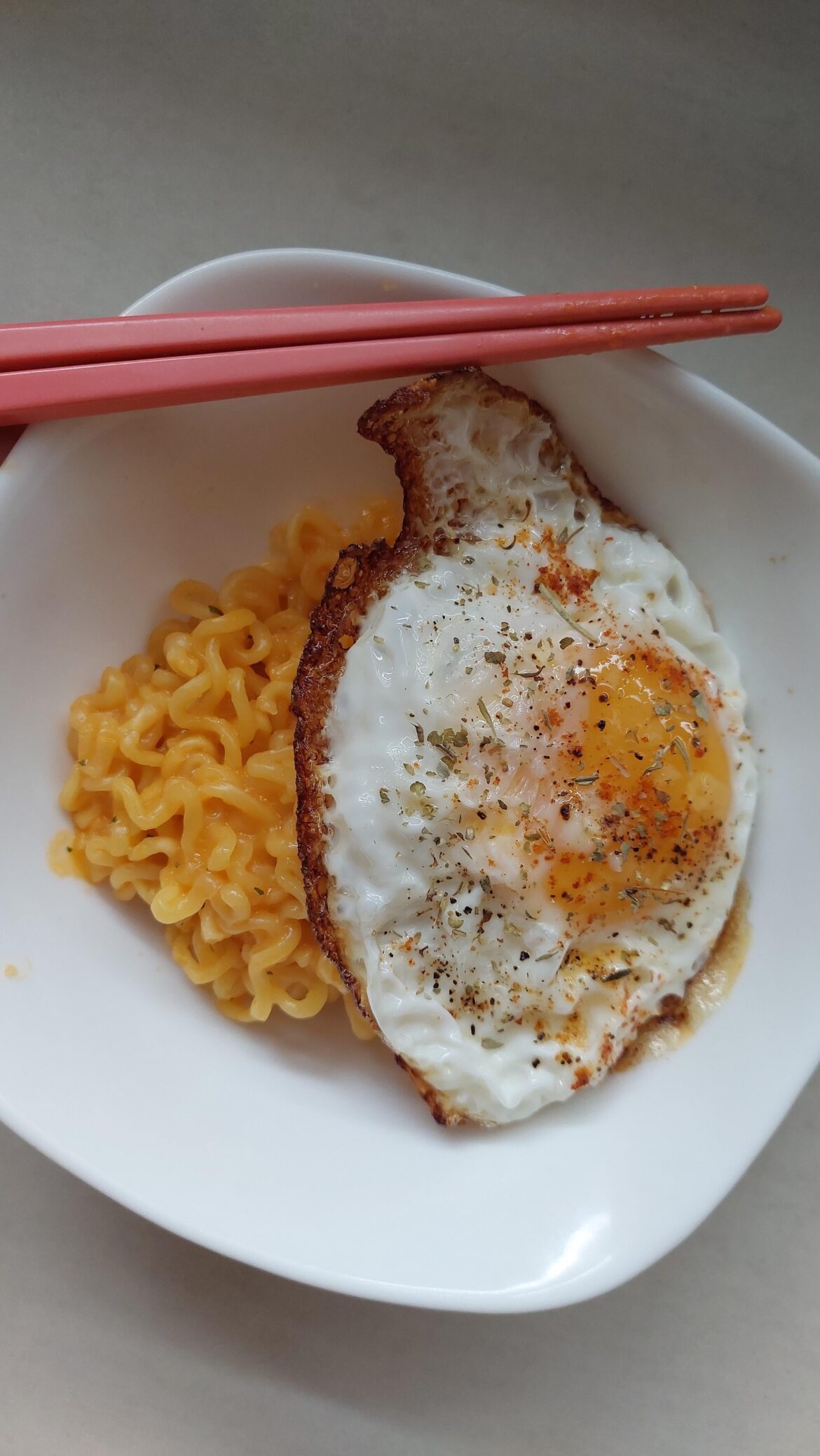 Crispy egg on cheese stirfry noodles