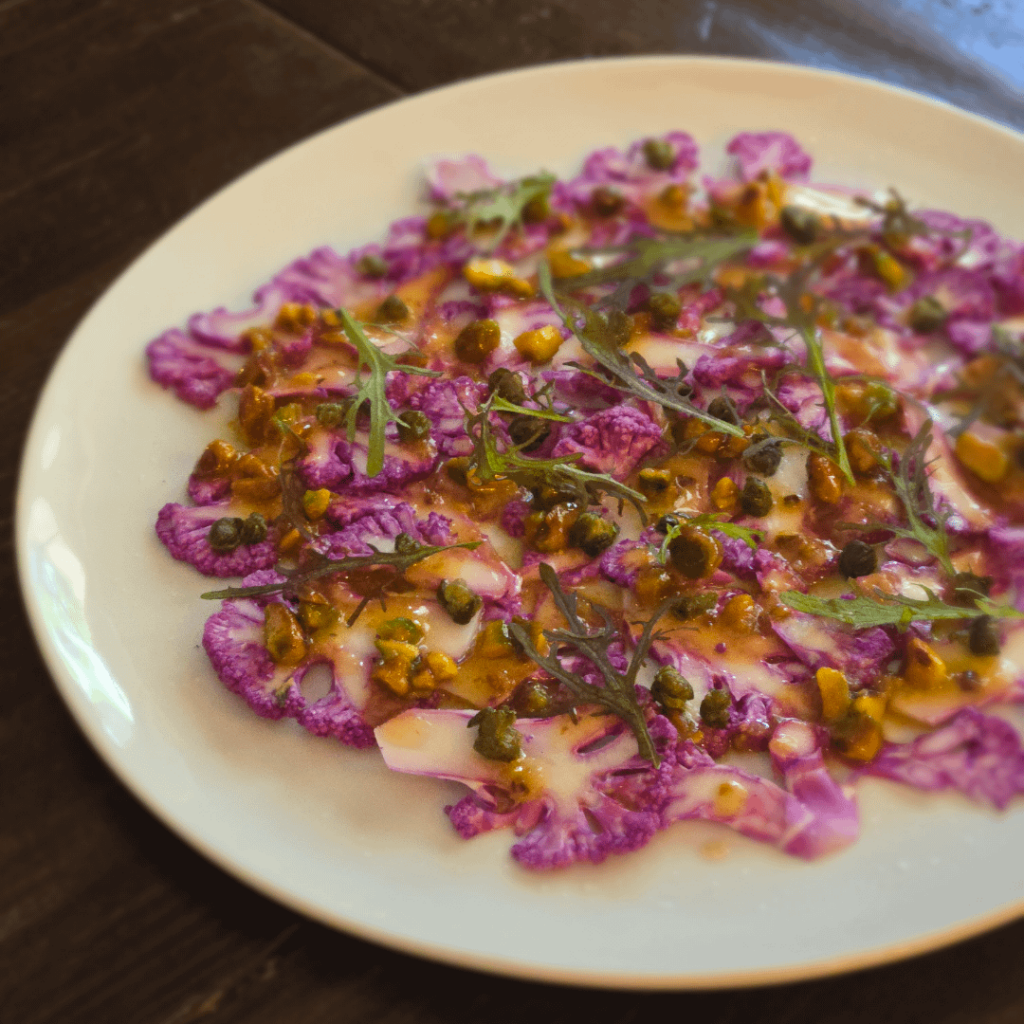 Raw purple cauliflower, pistachio meyer lemon citronette, red mizuna, fried capers