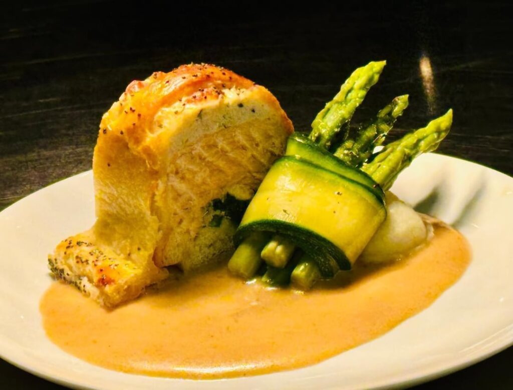 Salmon Strudel with Spinach on a Lobster Cognac cream sauce