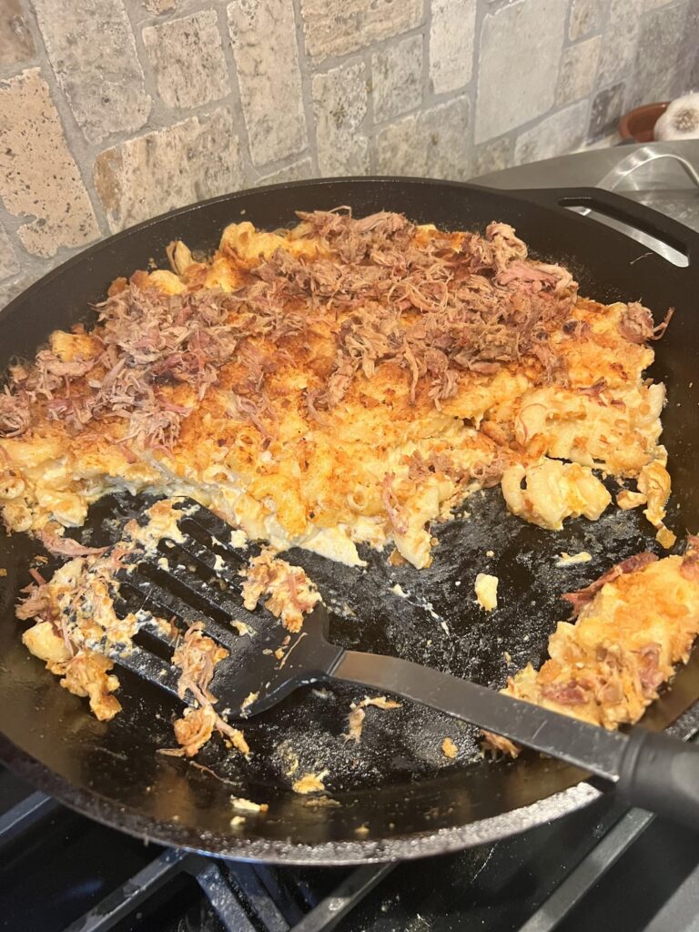 Smoked 3 Cheese Mac-n-Cheese with smoked pulled pork atop.  Found in traeger recipes accept for the pulled pork. Made some tweaks also.