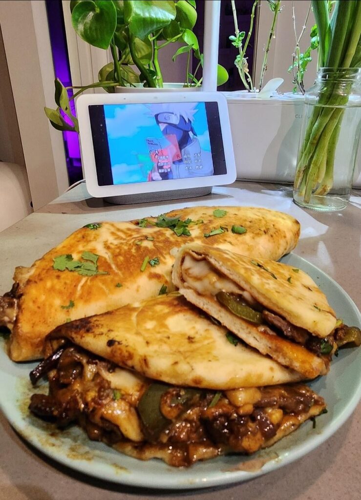 Steak and cheese on Naan garlic bread