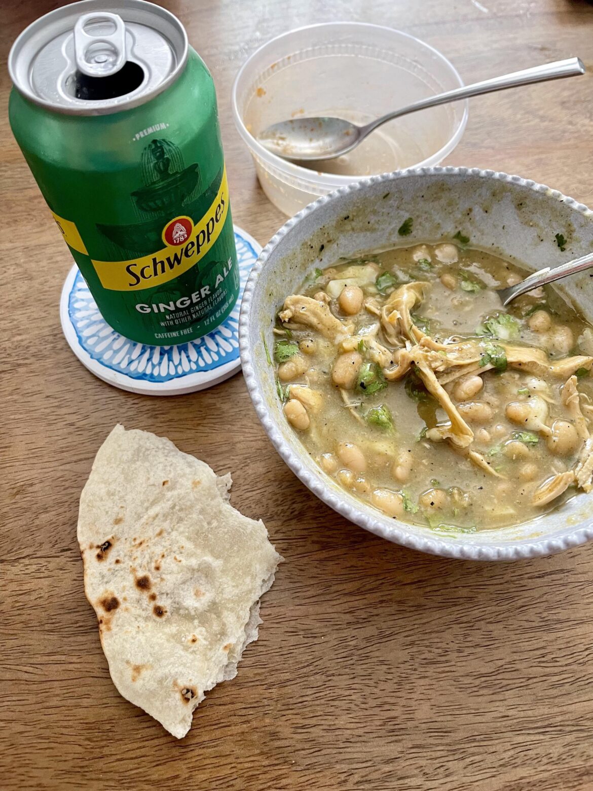 Chicken chile verde and fresh tortillas (and an empty red rice container)