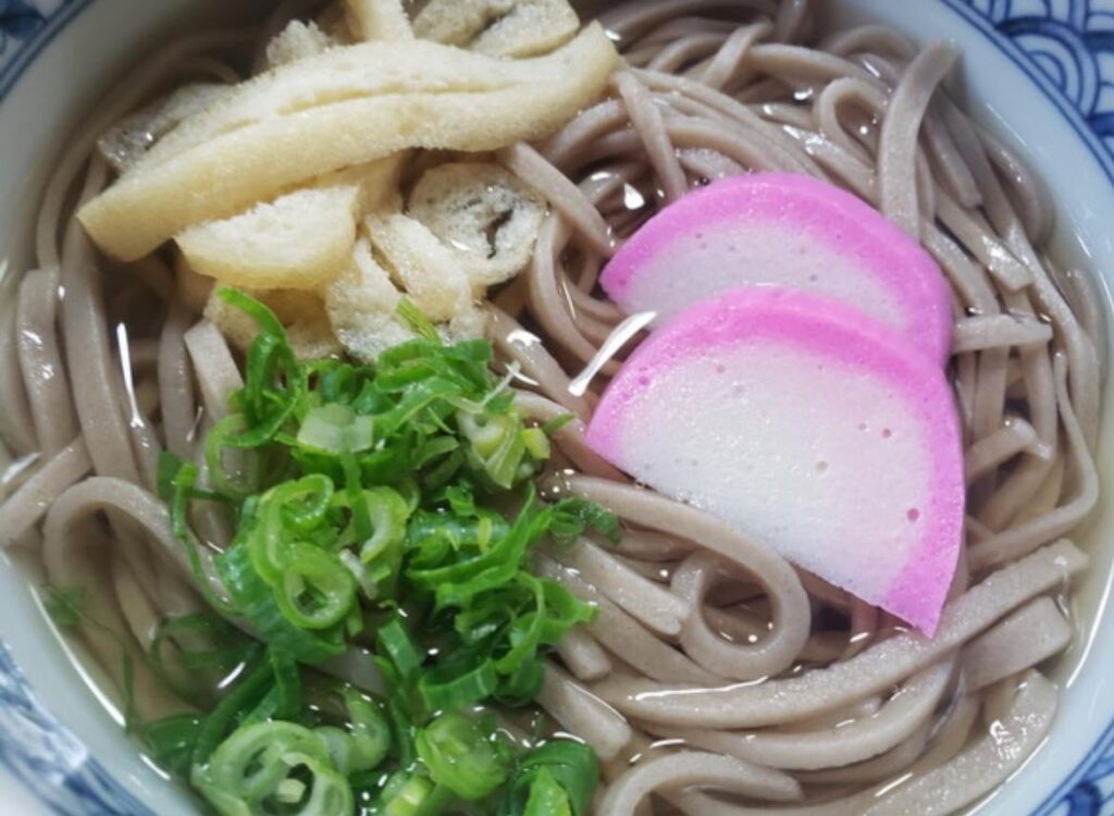 What is the purple and white thing in the dish?