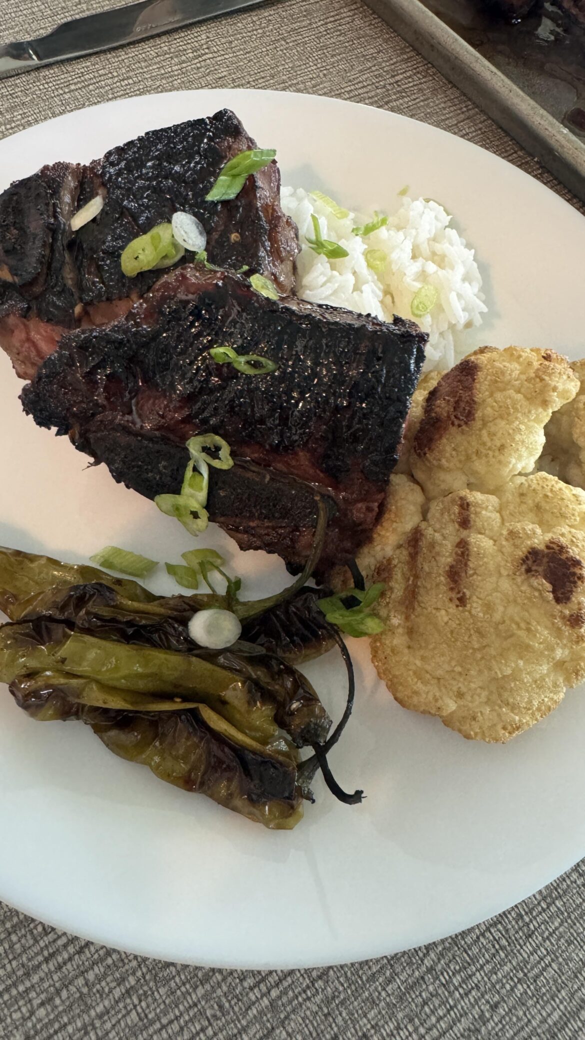 Beef short rib with cauliflower, shishito peppers and rice