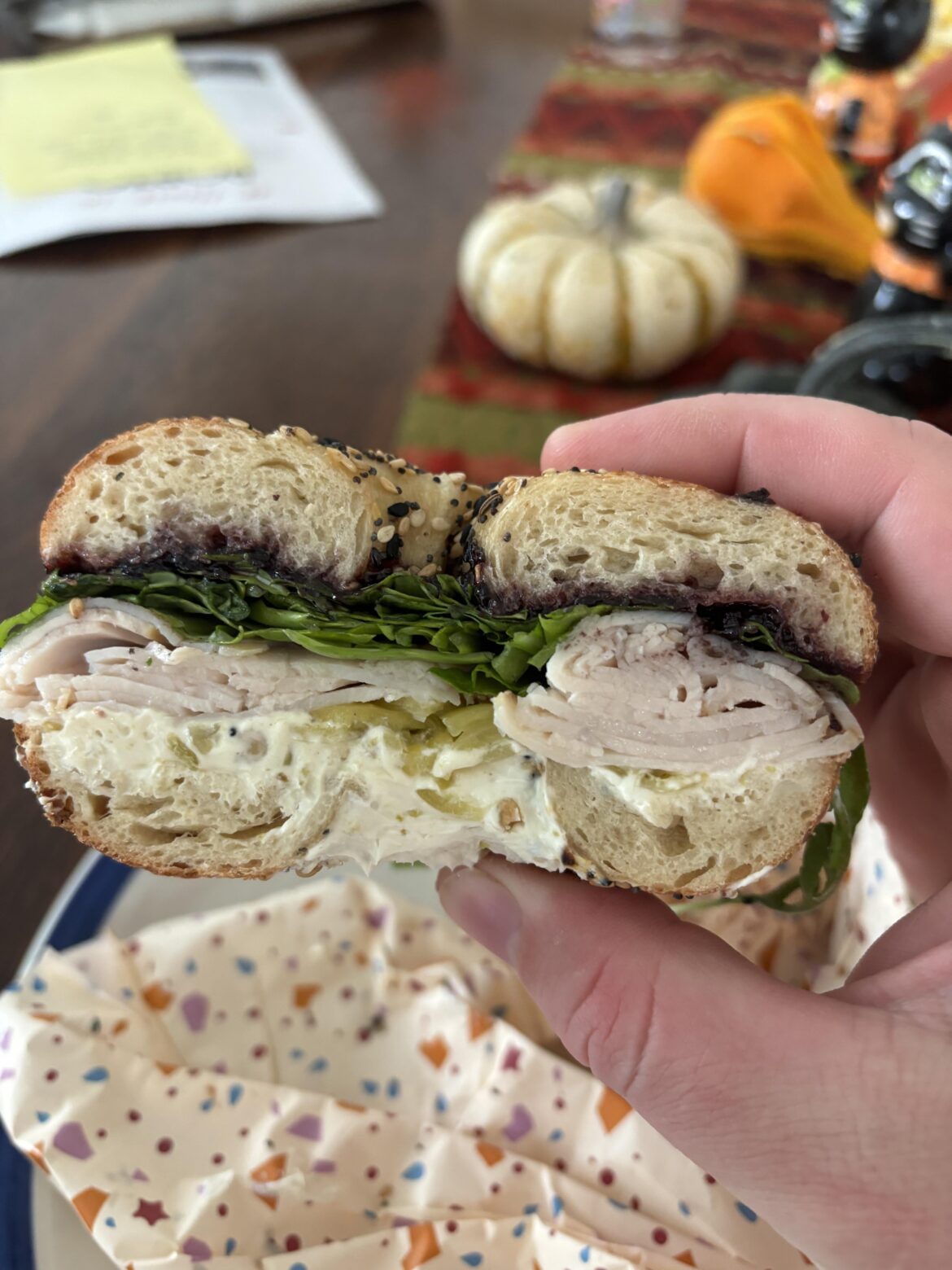 The Bluebird from Flour Moon Bagels in New Orleans: smoked turkey, arugula, jalapeño cream cheese, blueberry jam, and banana peppers on an everything bagel