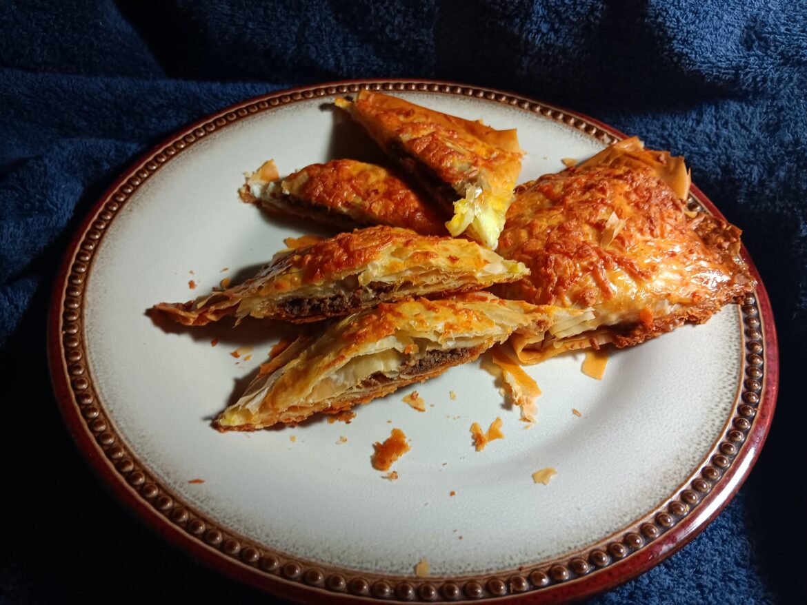 Culinary leftover makeover: velveteen steak puffs (pureed and creamed steak( leftover London broil, Mayonnaise and olive oil, and some left over black bean paste.)) with cheese (taco blend.)