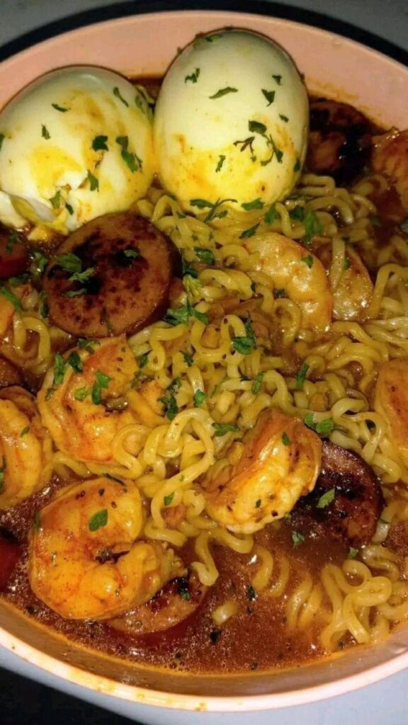spicy noodles with seared kielbasa shrimp 🍤 and soft boiled egg 😋