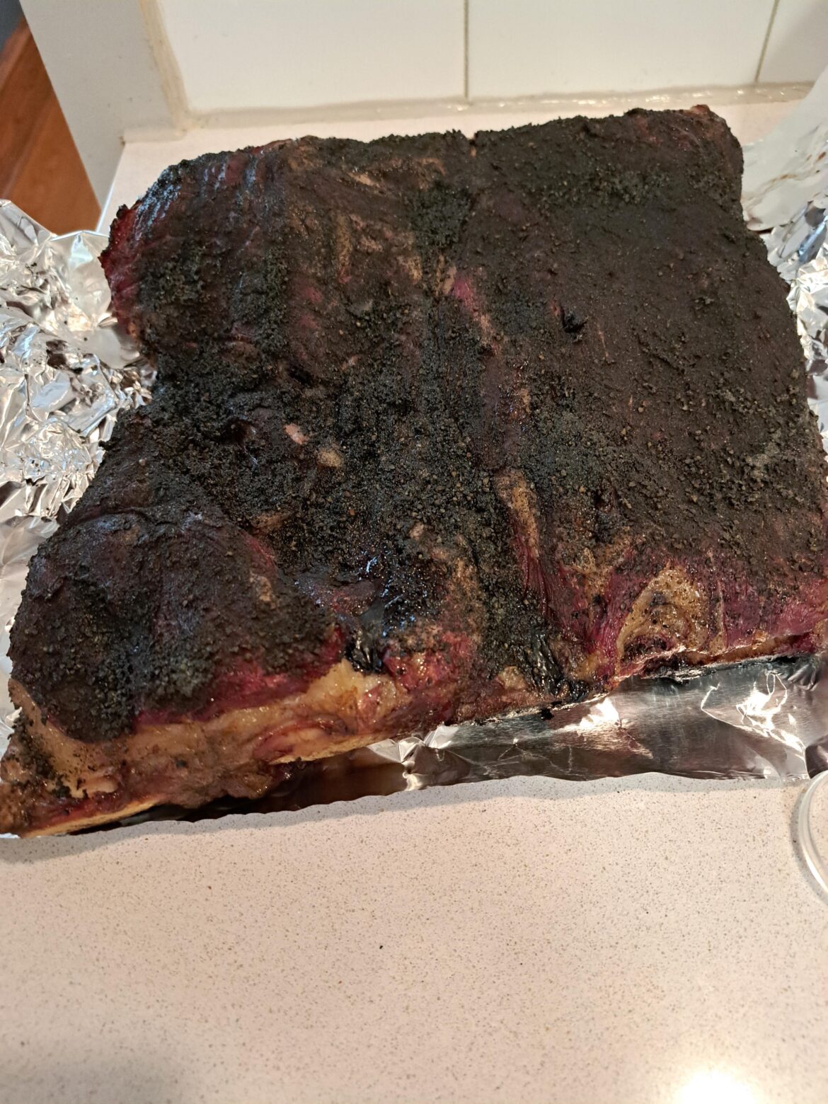 First time doing beef ribs. Temp says 205, but not a lot of pulling back from the bone. Is this ok?