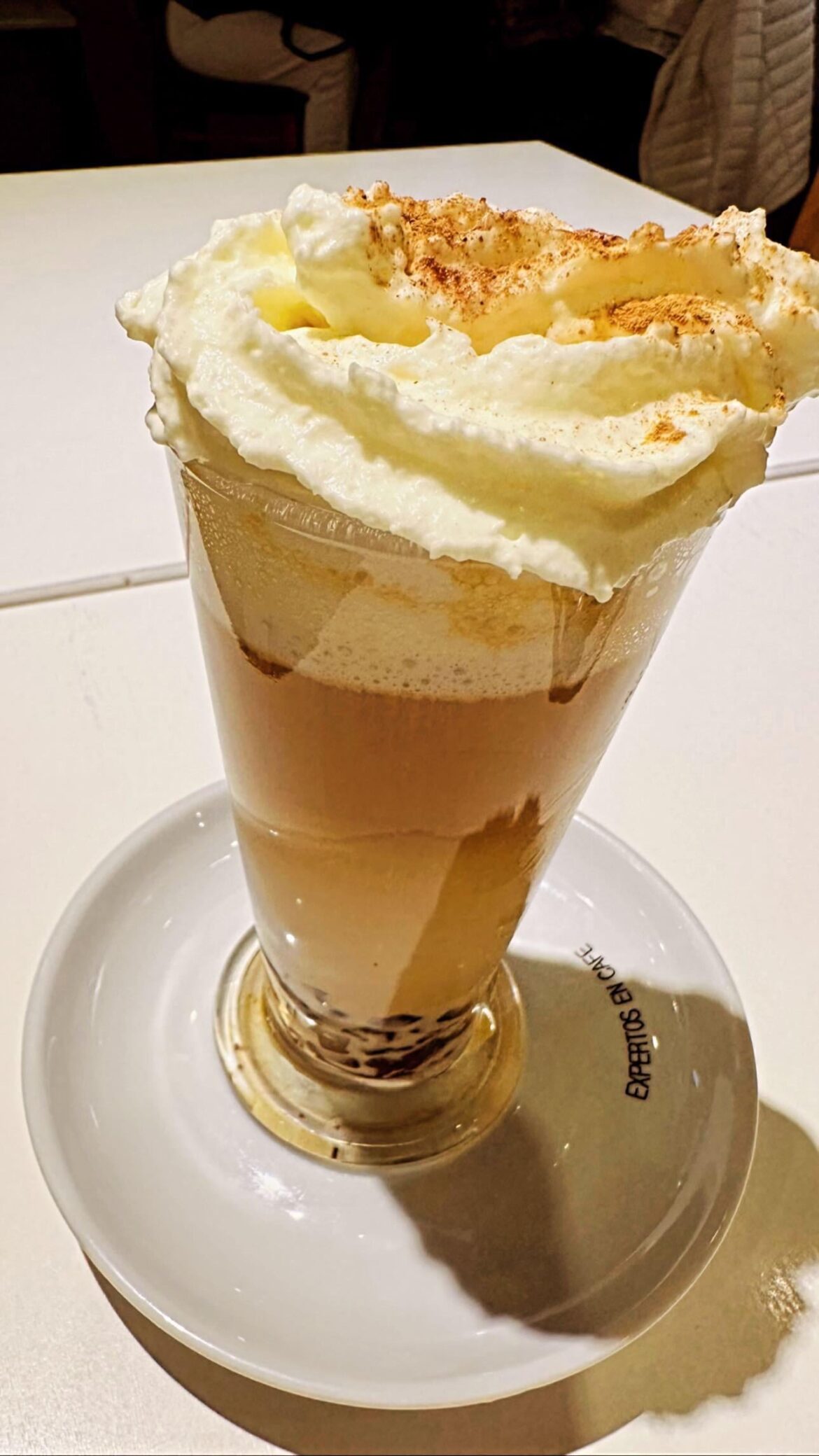 Capuccino with cream and cinnamon
