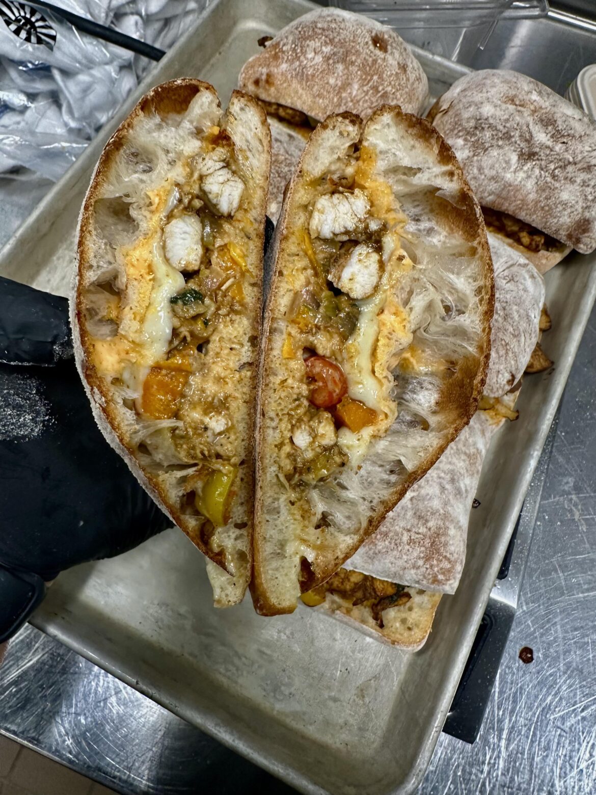 Pepper chicken with Swiss and sriracha mayo.