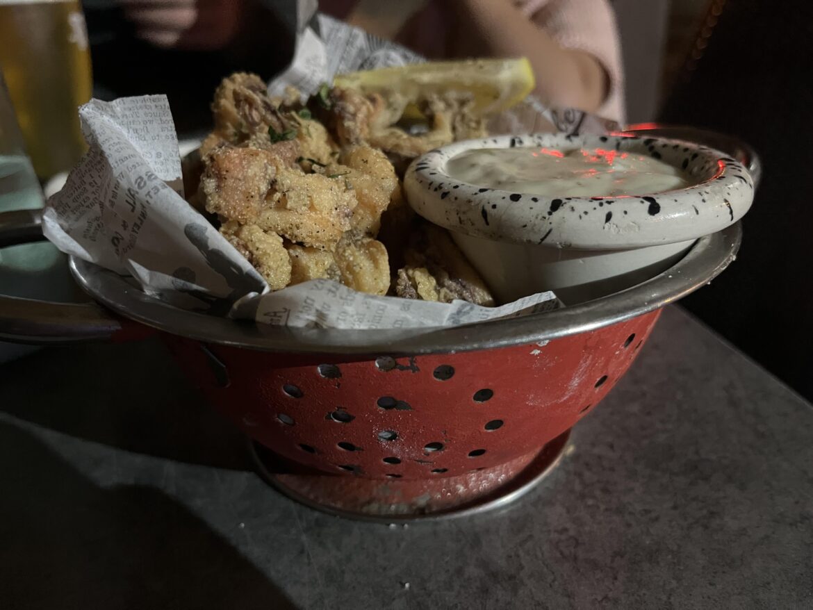 Calamari fritti served in a pasta strainer