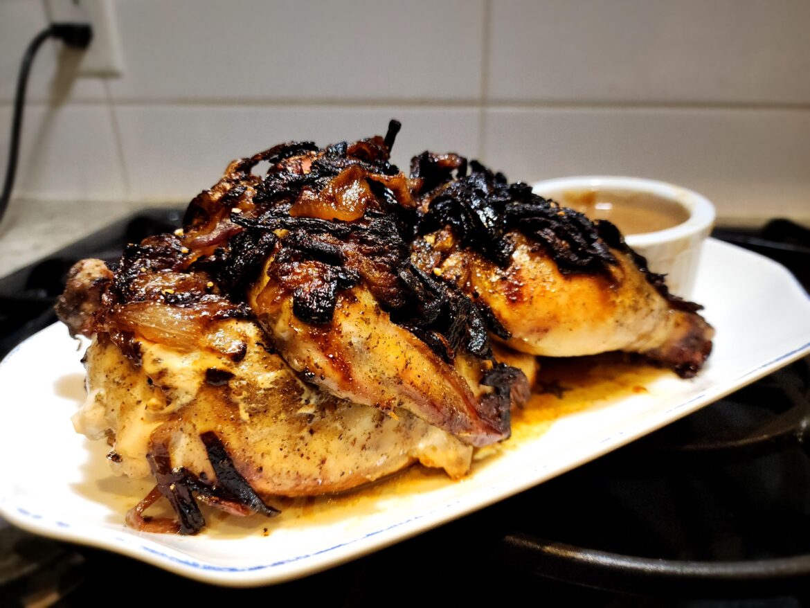 Half Chicken baked with caramelized onions