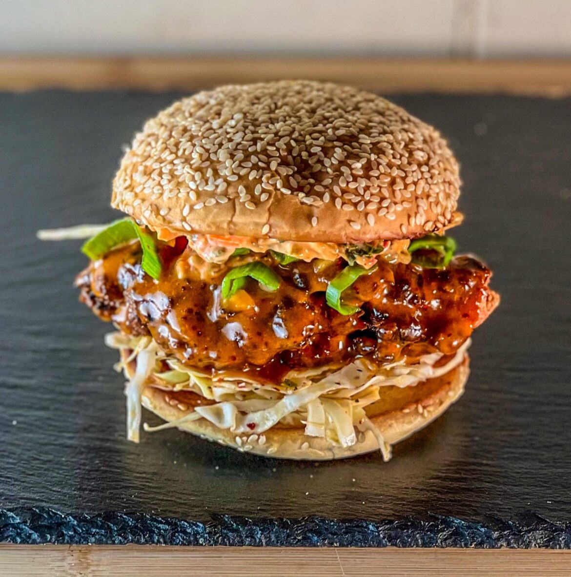 Crispy chicken thigh sandwich with some kimchi mayo and cabbage slaw