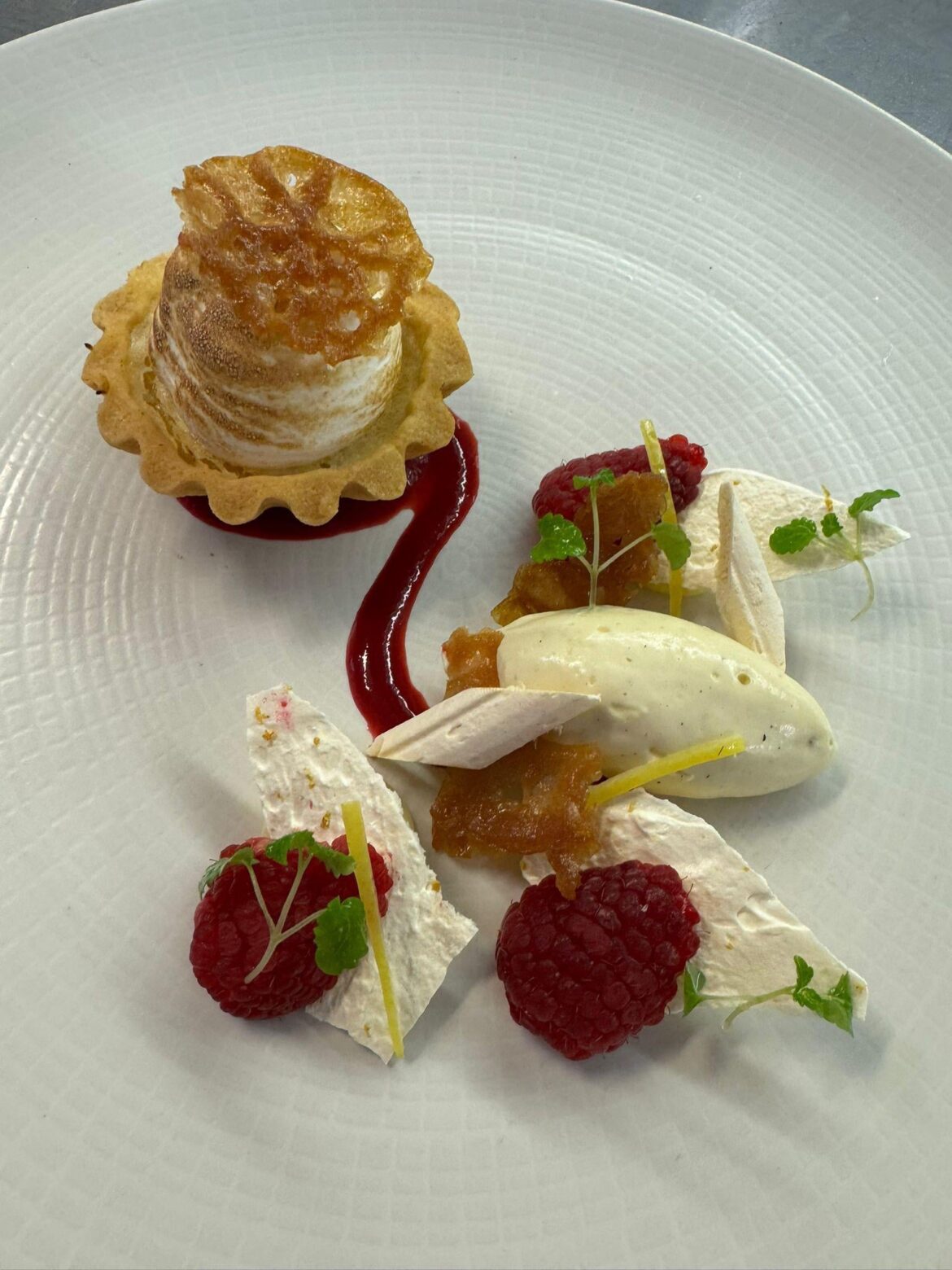 Lemon meringue tart, brandy crisp, lemon curd, meringue shards, vanilla chantilly, fresh raspberries and candy lemon zest. NOM NOM