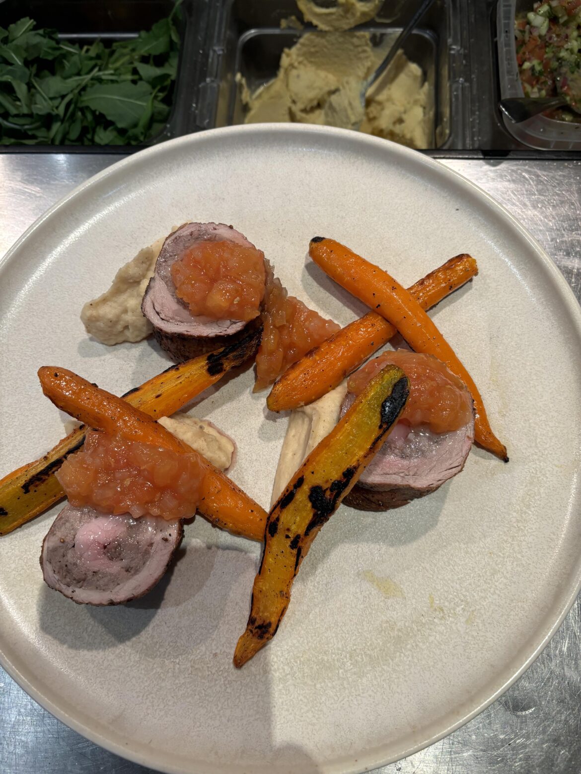 Sausage stuffed pork tenderloin, Celeriac puree, roasted carrots, heirloom tomato conserve