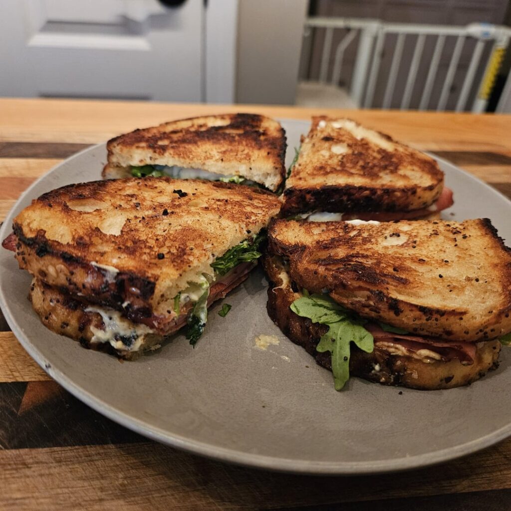 Mortadella, havarti, with arugula on toasted everything sourdough. Mayo and Dijon.