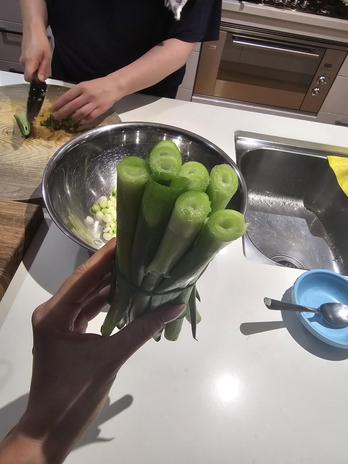 My sister only uses the white part of the spring onions....she was going to throw this out.