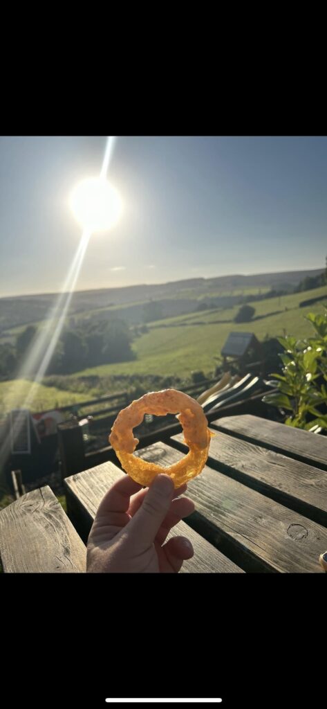 Mac and cheese on chips with beer batter onion rings. Amazing view too!