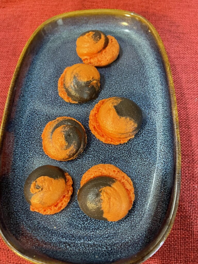 So I wanted to make orange and black macarons for Halloween. But the result was a fail. Wondering If I just screwed up my batter that day, or was it because the black batter had less almond powder and some cocoa powder in it? Did you ever successfully mix cocoa batter and regular batter?