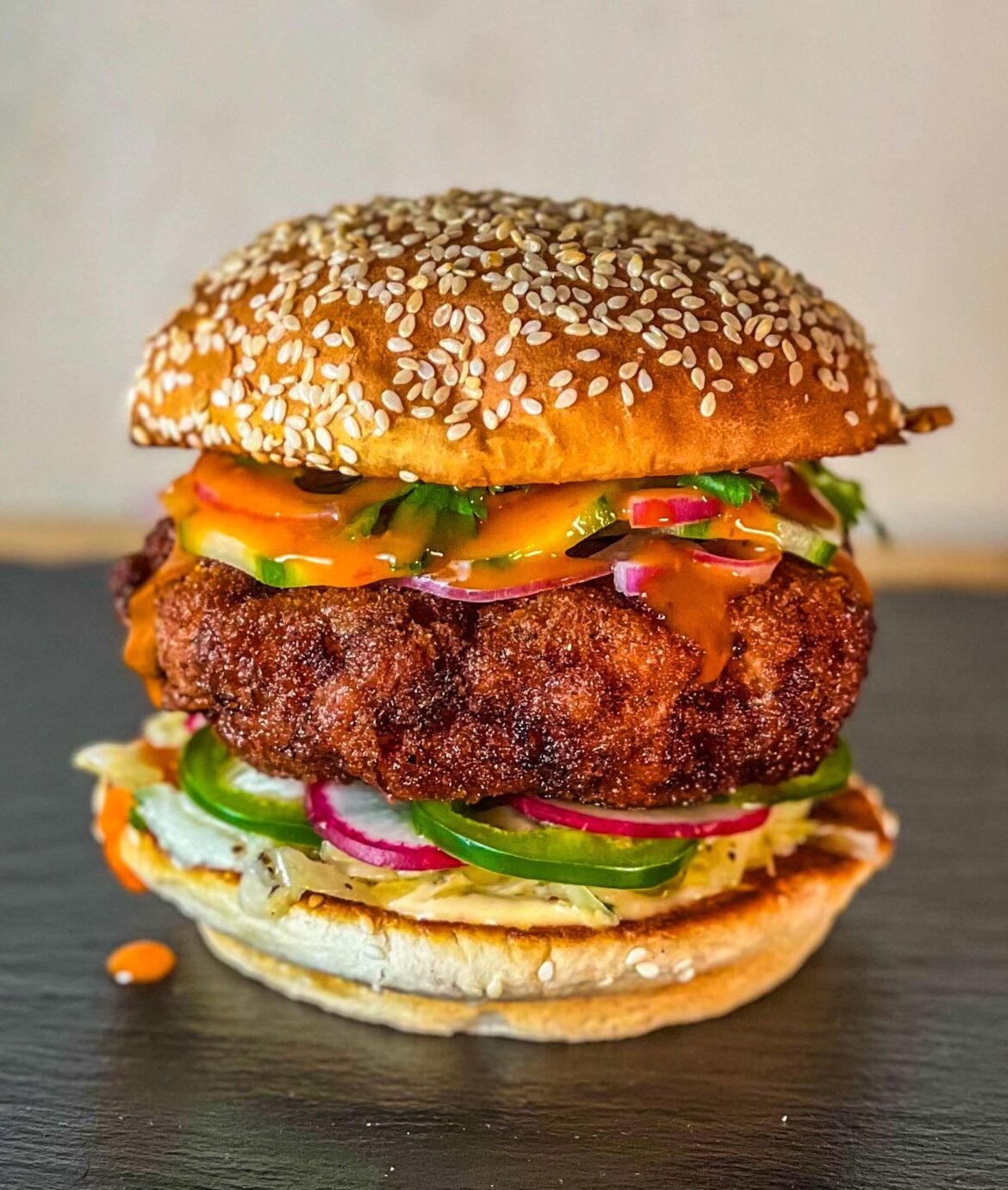 Fried shrimp burger, quick pickled cukes/onions, vinegar slaw, cilantro, jalapenos, radishes, sambal mayo and sriracha wing sauce. Just tossed everything in the fridge on this one.