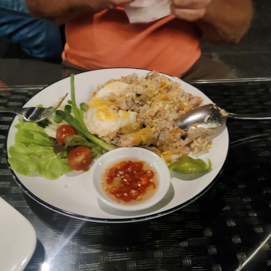 My friend dinner last night Pork fried rice 120 THB $3.45 Cashew chicken 140 THB $4.02 He said they were delicious Matter of fact he said the cashew chicken with the best he's ever had.