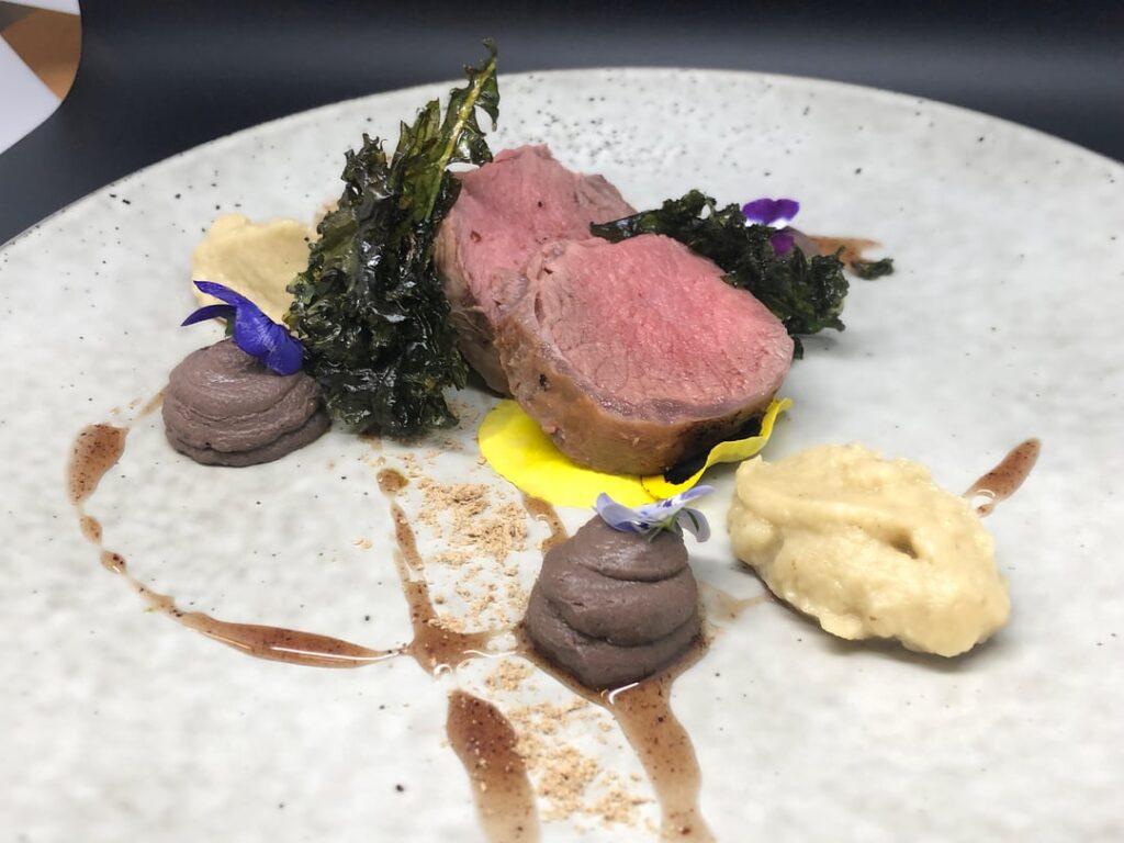 Lamb loin, black olive caramel,liver patè, Smoked aubejine, blackened onion & coriander dust