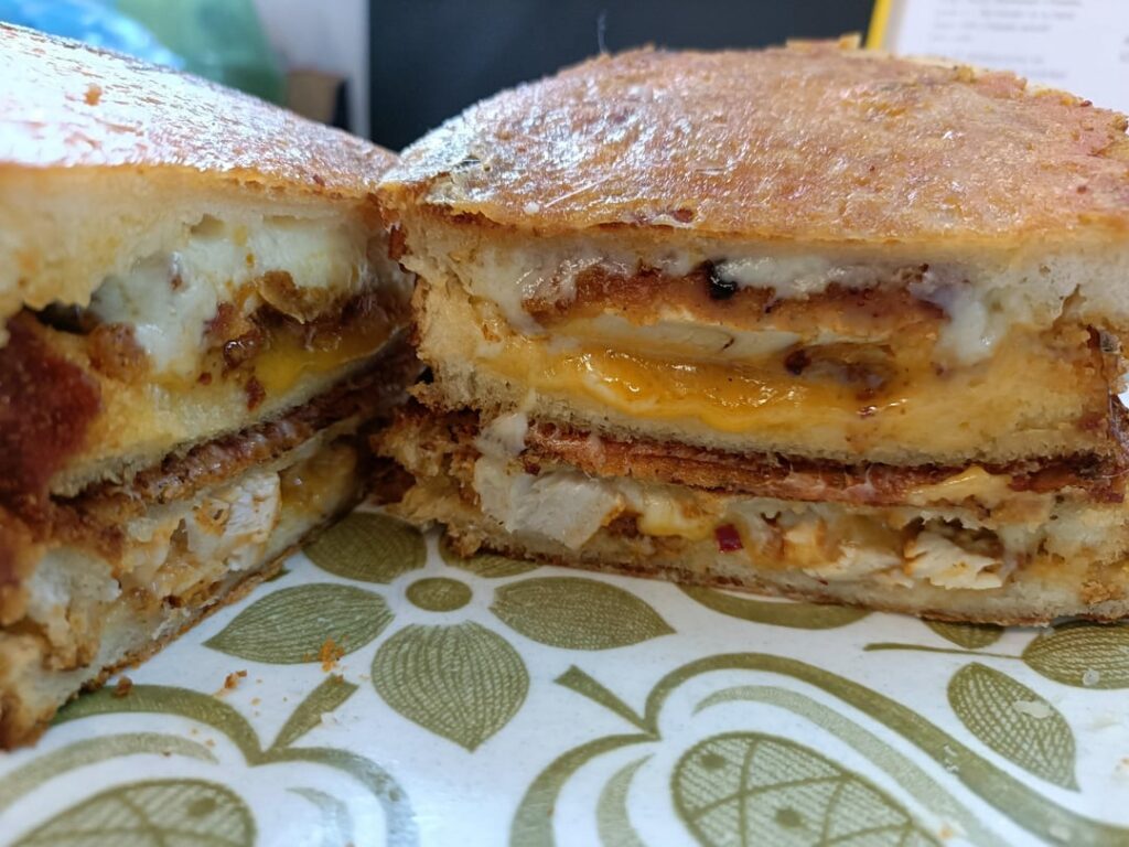Spicy breaded chicken, red leicester and applewood smoked cheddar toasties. In tiger bread with a cheddar crust.