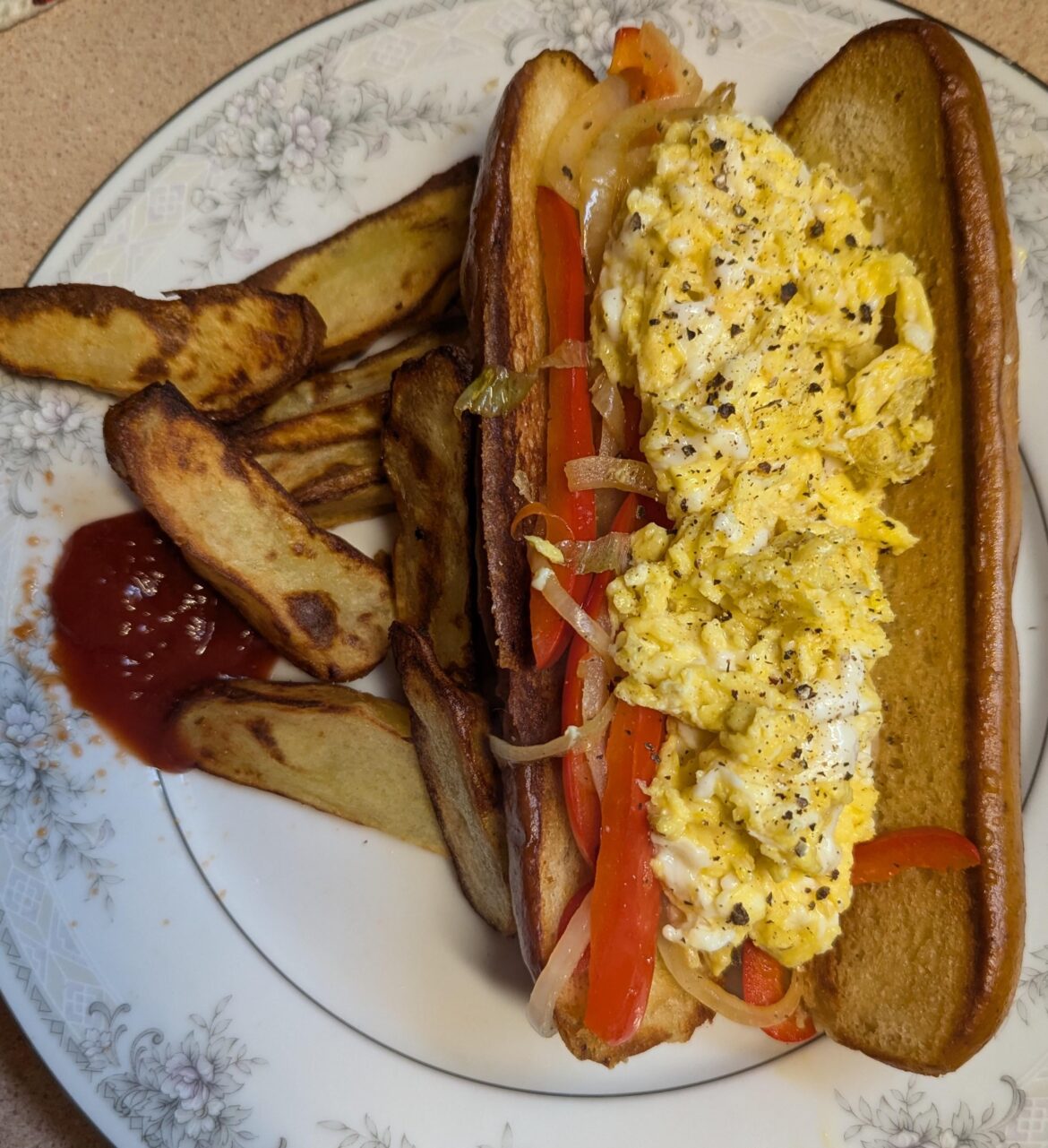 Peppers and eggs on a pretzel roll