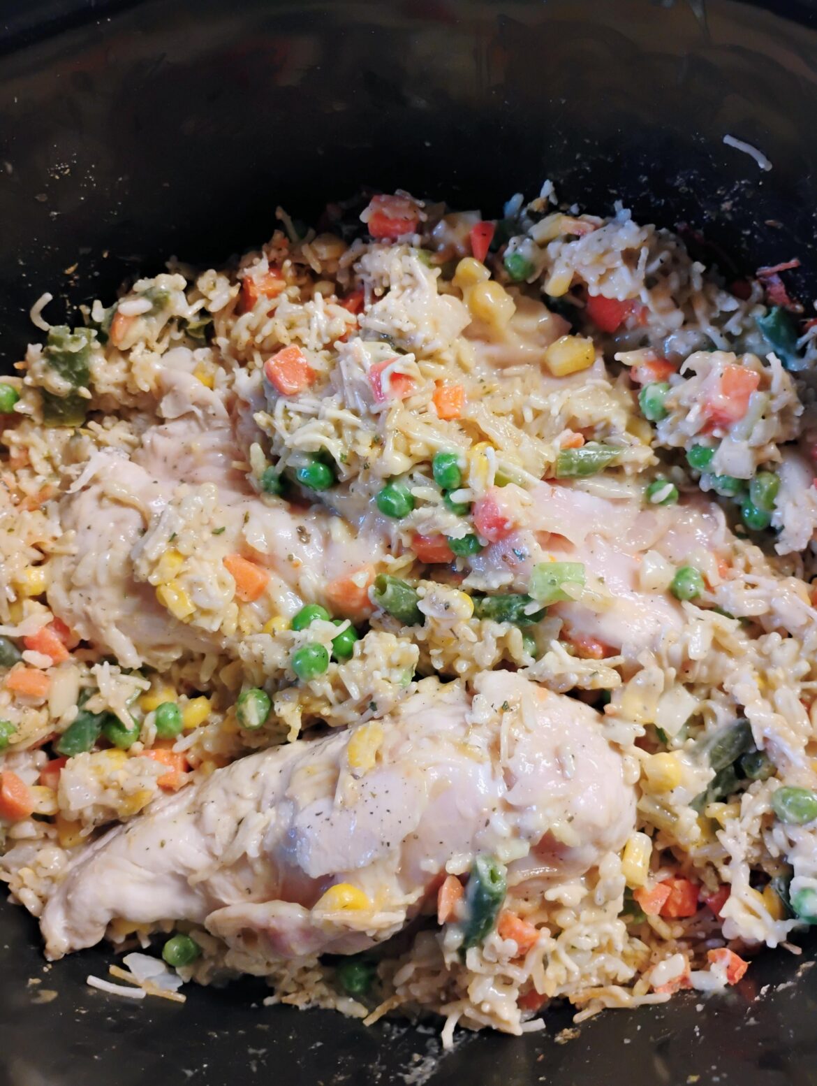 Chicken breasts with rice and mixed vegetables - add some herbs and spices - a can of cream of chicken and some broth. Low for 6 hours.