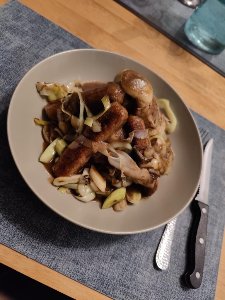 Bangers and mash with onion gravy and leeks