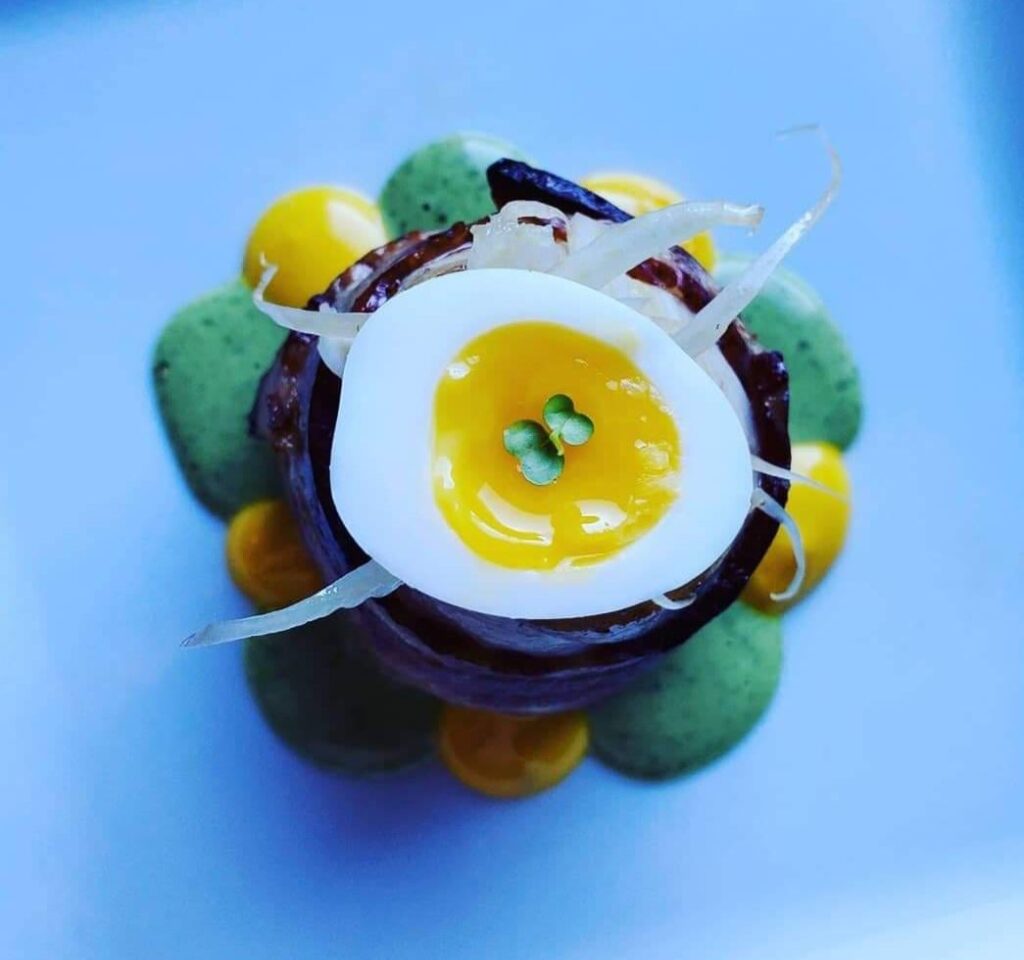 90's throwback. Bacon wrapped Arctic Char,quail egg, shaved fennel, fennel and saffron emulsion