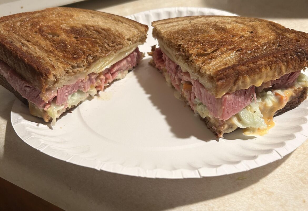 Cooked at home corned beef, swiss cheese, coleslaw, and Russian dressing on a butter marble rye.