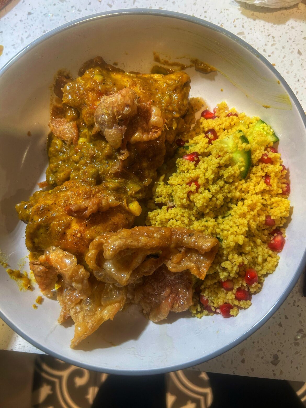 Lemon and saffron chicken Tangia (Moroccan) with couscous and crispy chicken skin