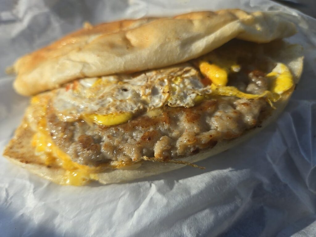 Working in Port Newark NJ enjoying a massive sausage egg and cheese from the pier lunch truck for lunch