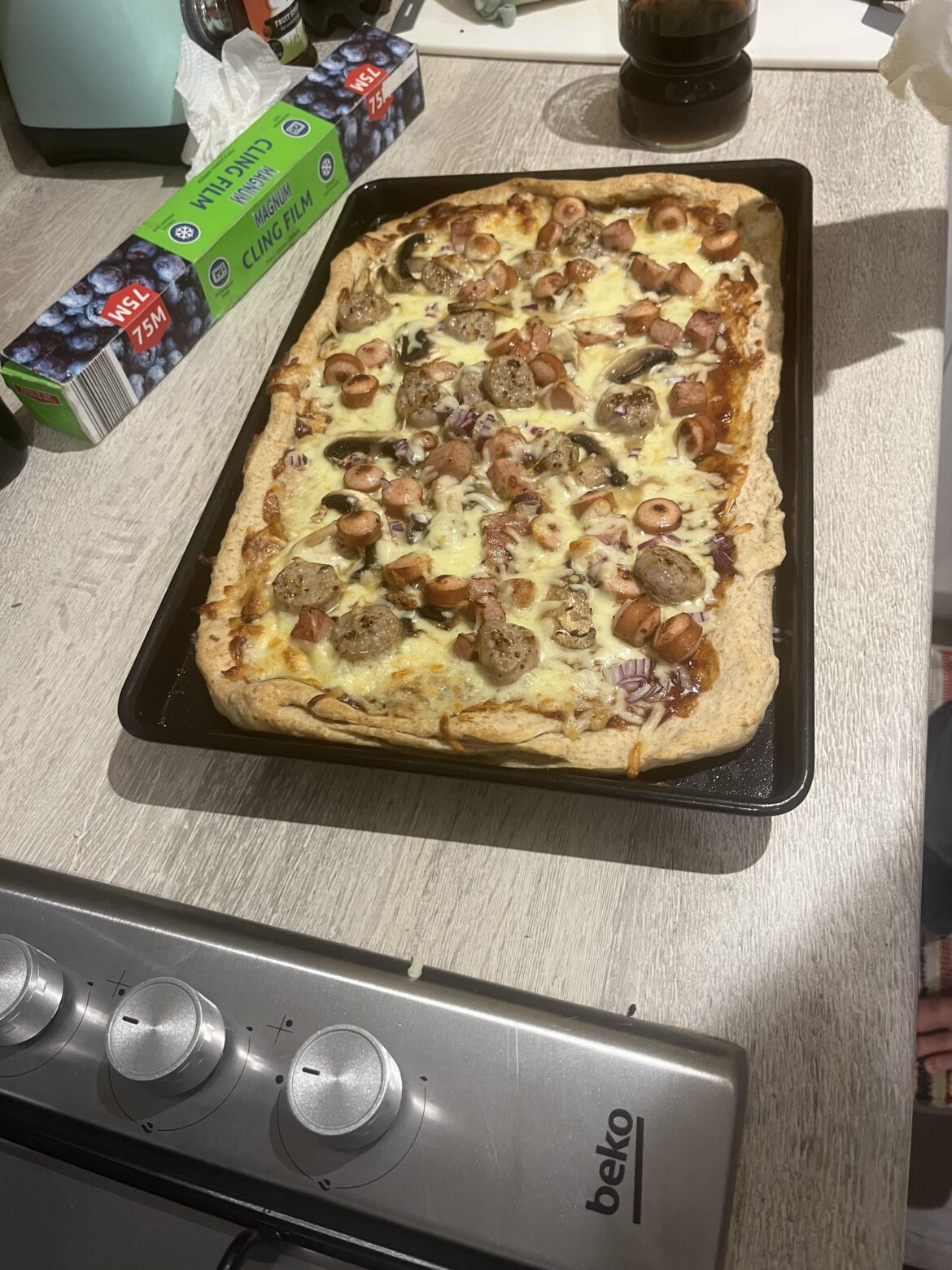 You guys were divided about my BBQ sauce pizza. Here is my fiancé’s. It has hotdogs and sausage on it. In addition to BQQ sauce.