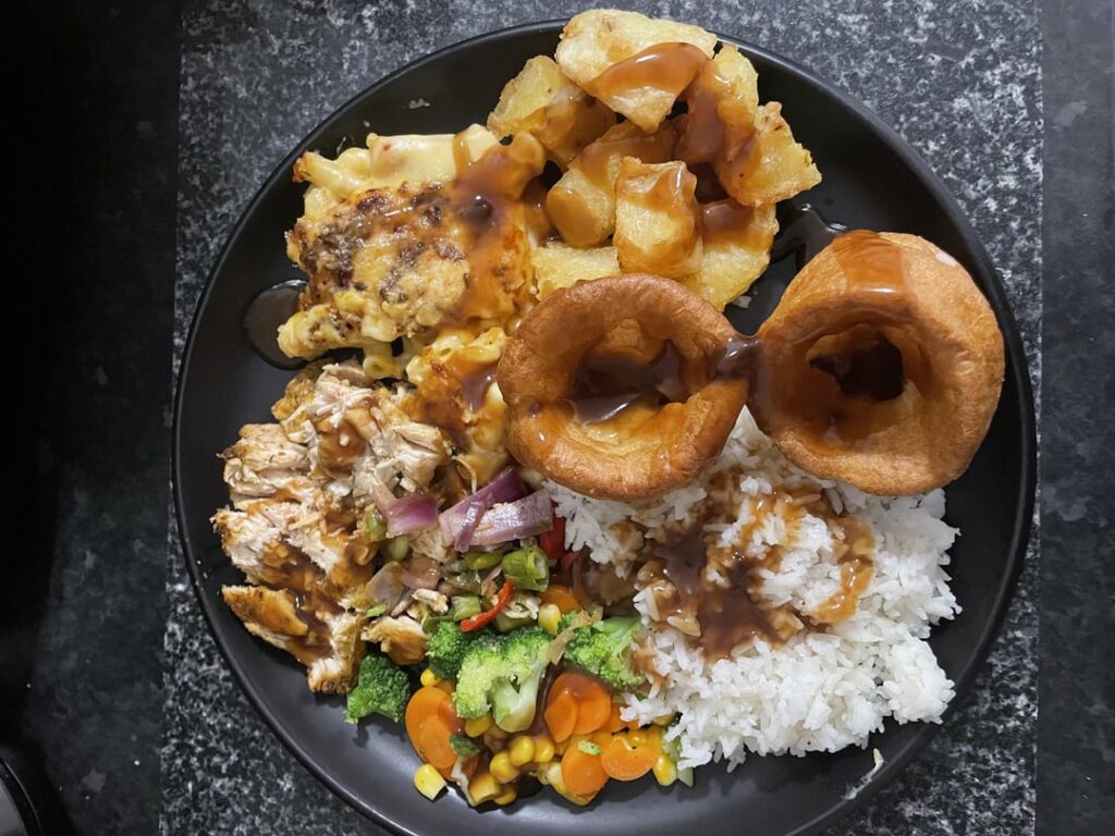 Late roast. Chicken, rice, roasties, mac n cheese, yorkies and veg 😊