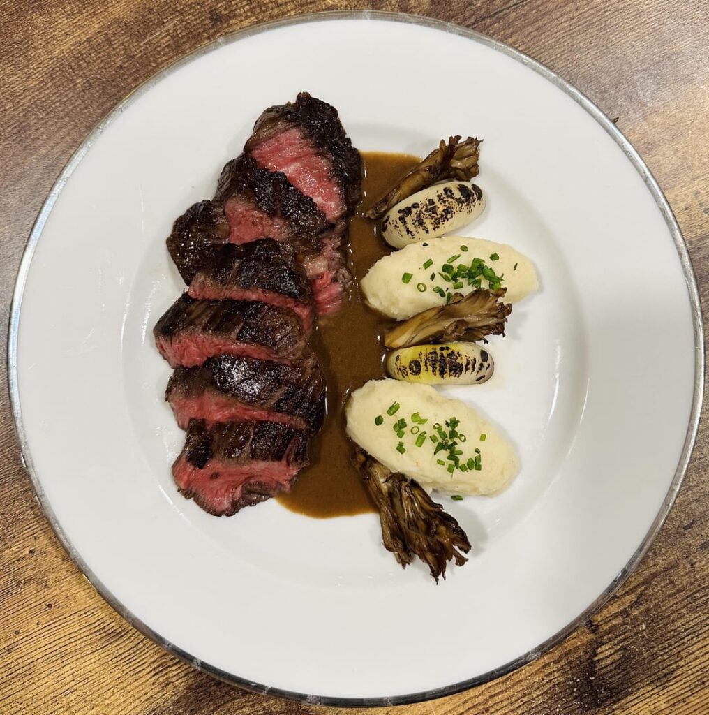 Australian wagyu hanger with pomme purées, Cipollini, Pickled roasted maitake & habanada brandy reduction