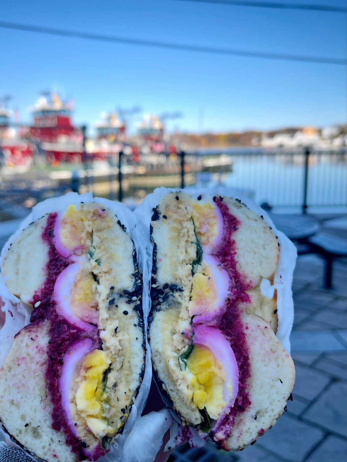 The spectacular, inimitable simit breakfast sandwich from Elephantine in Portsmouth, NH (jammy eggs, grated beet, spinach, za’atar feta, and hummus)