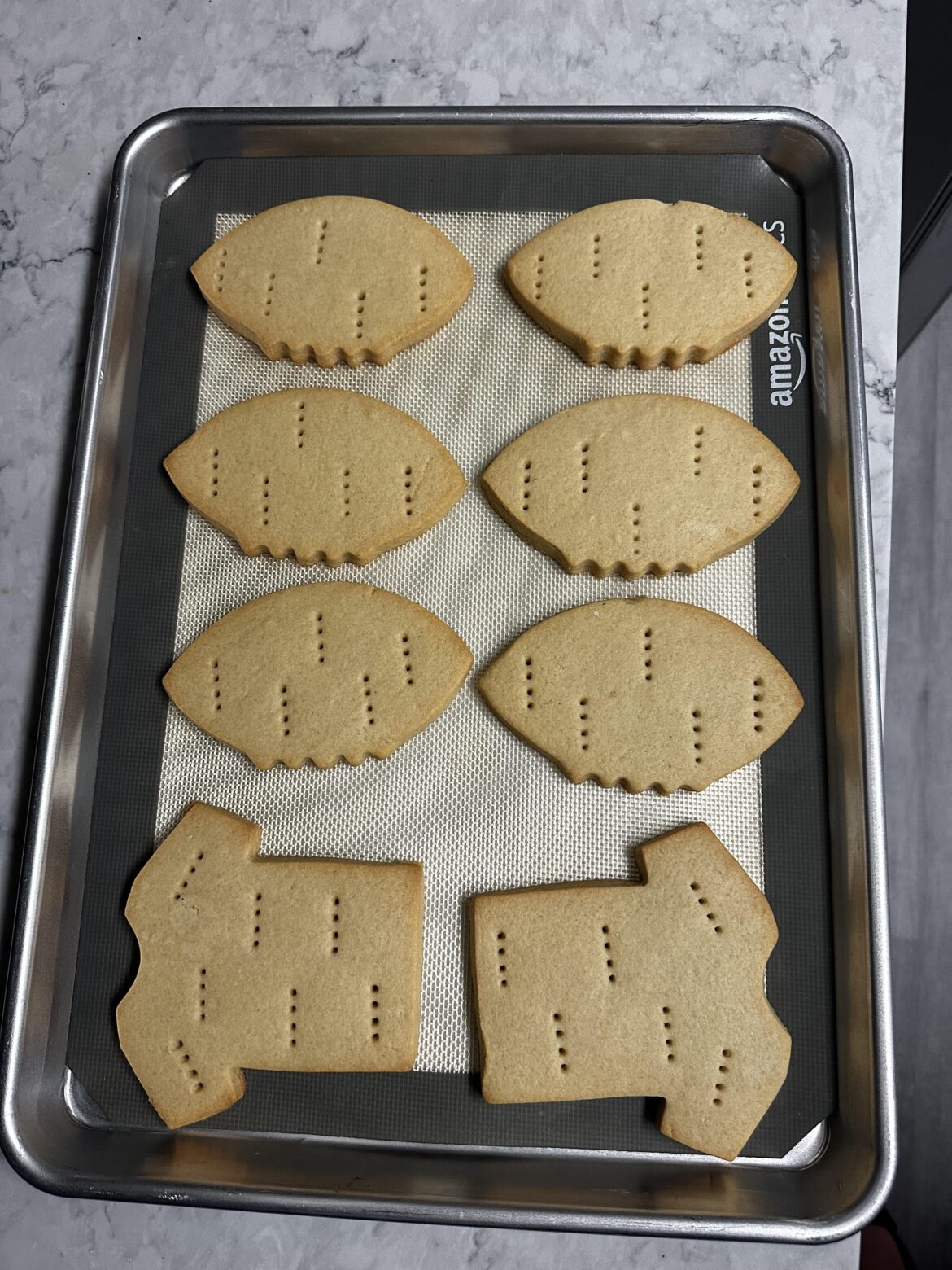 I know these aren’t decorated yet, but I’m so freaking happy with how this rollout, cut and bake came out I just had to share them.
