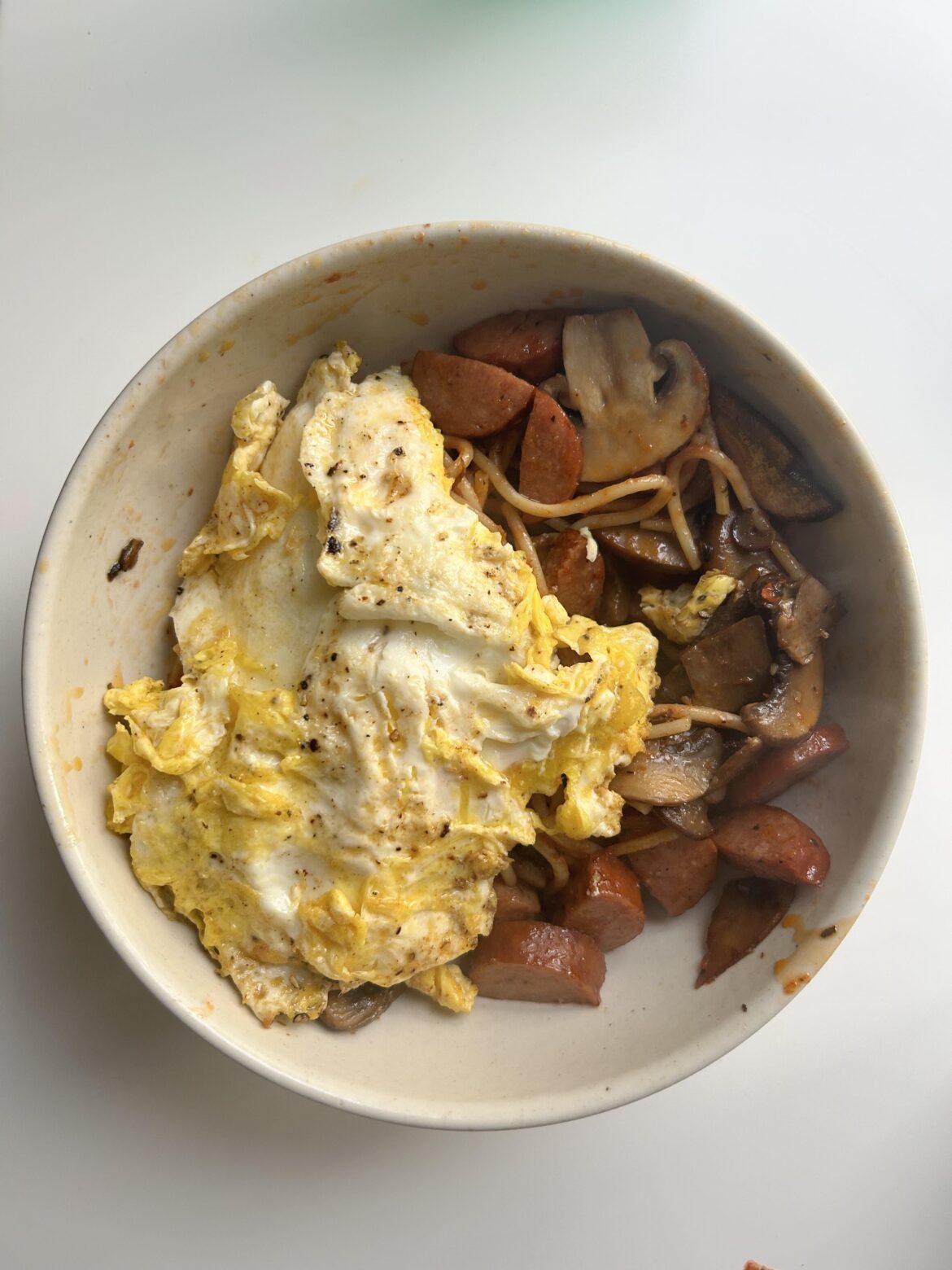 Left over pasta my kids didn’t eat + mushrooms + sausage and 2 fried eggs