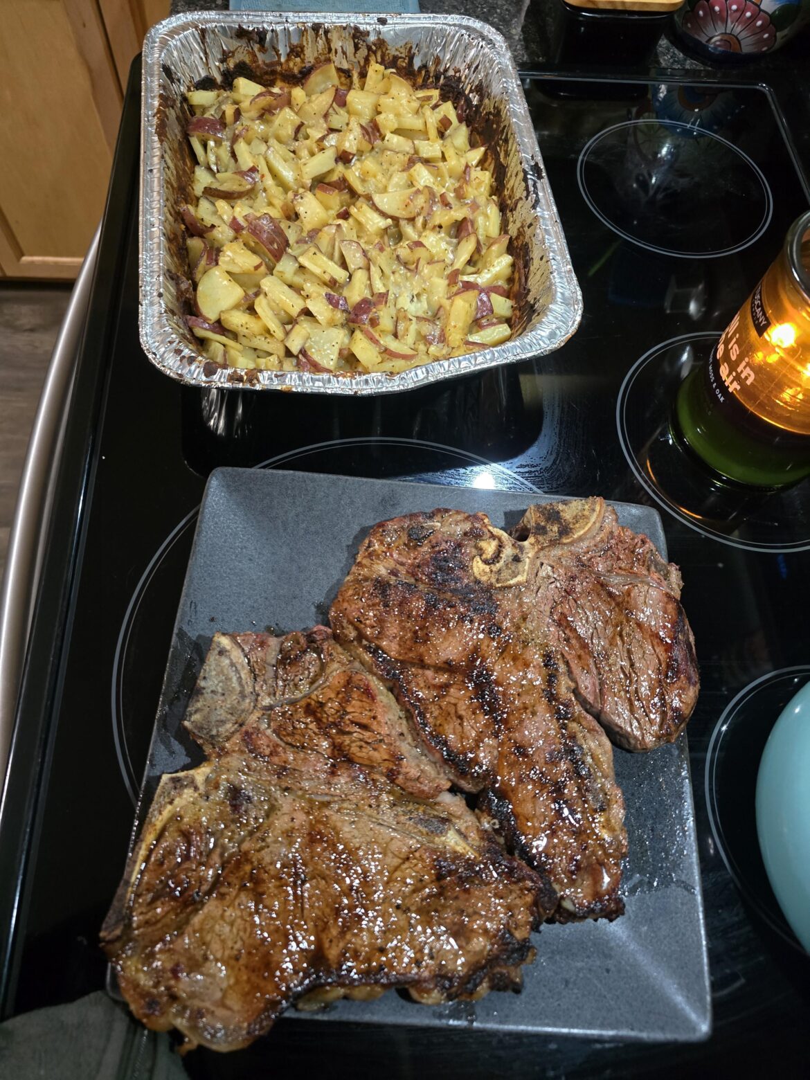 Grilled T-bones and potatoes