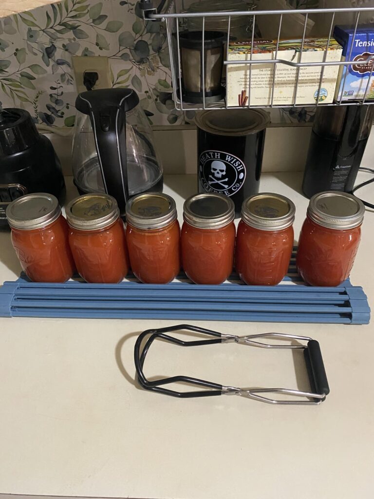 Managed 6 cans of tomato sauce from my garden plants this year! Managed 6 cans of tomato sauce from my garden plants this year!
