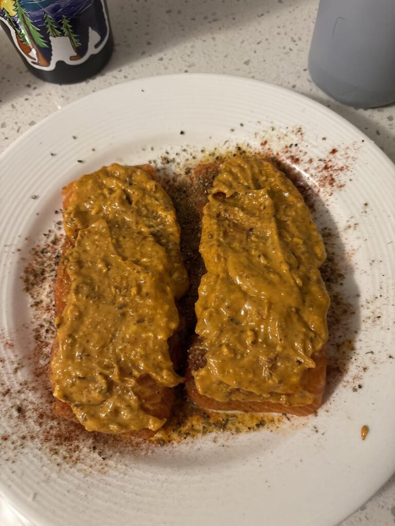 Smoked salmon filets with chili crisp butter.