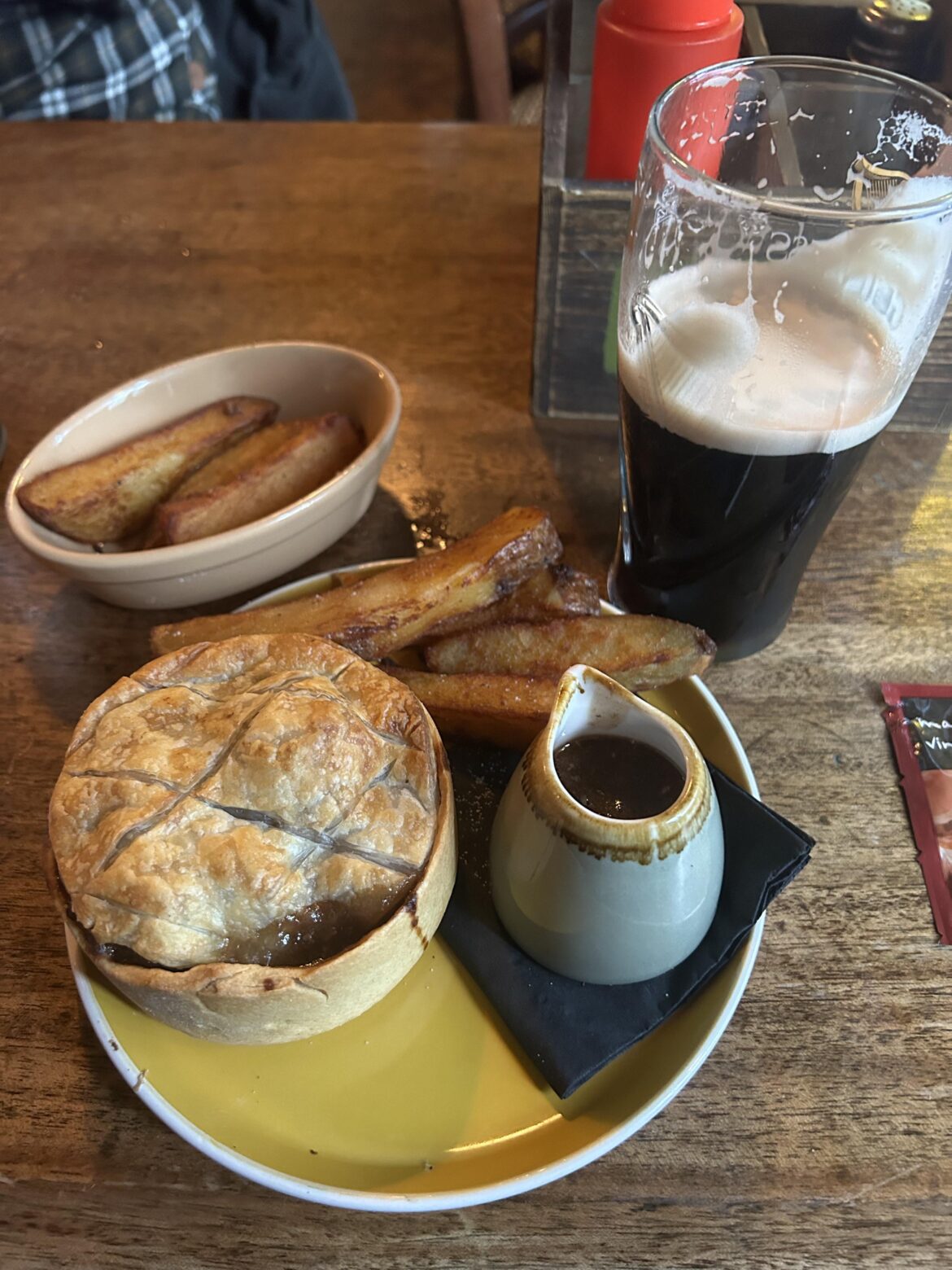 Steak and ale pie, triple cooked chips, and a pint of Guinness