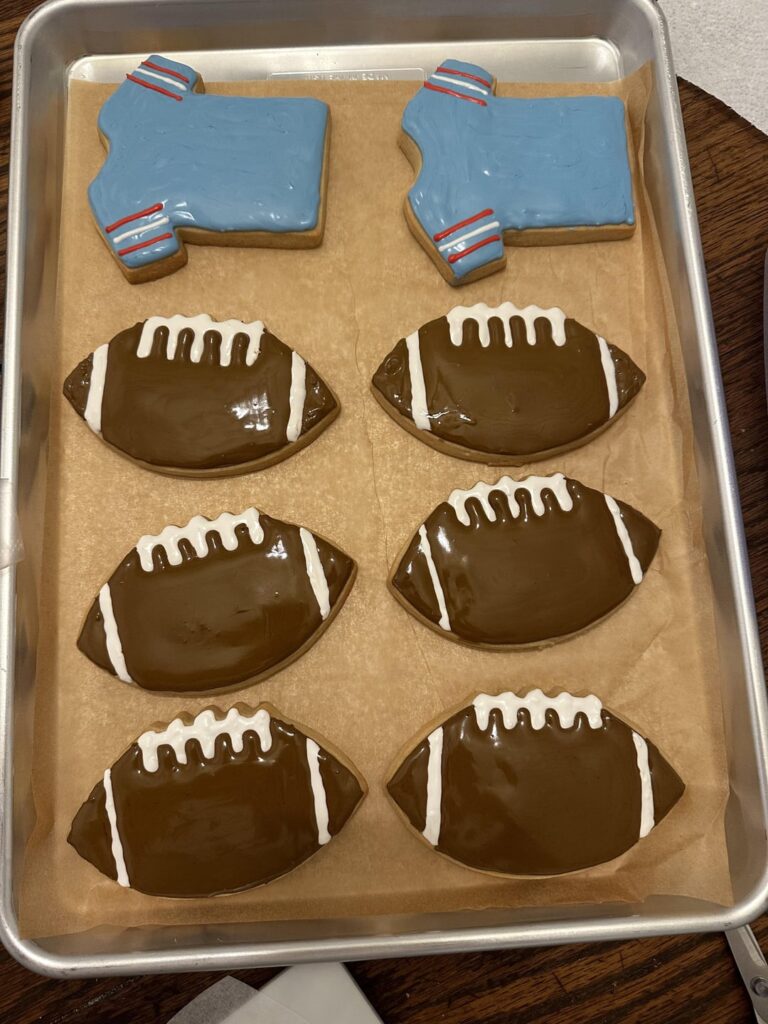 So I figured I’d show you guys every step of the process. Here’s the flood and royal icing transfers for the footballs and jerseys.
