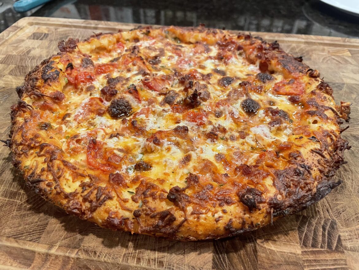 Cast iron style stuffed crust pizza with prosciutto and cherry tomatoes.