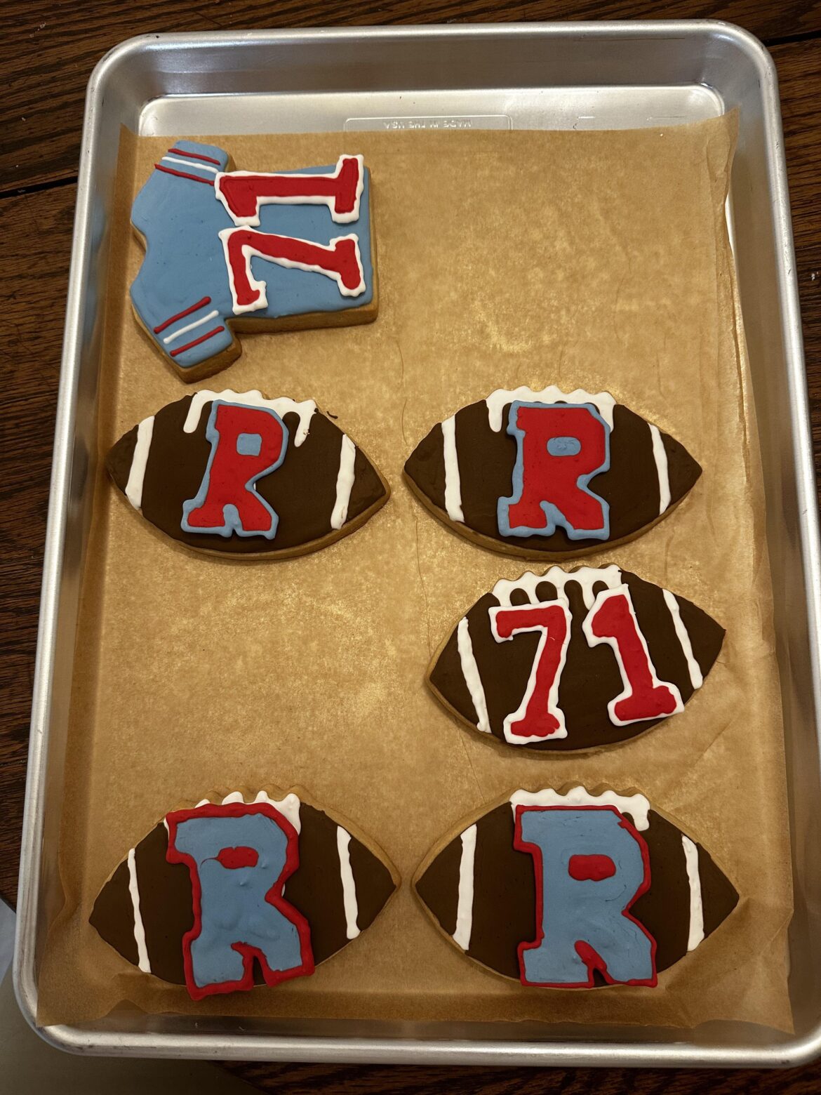 And the final step, attaching the royal icing transfers. I may have made a couple of the logos and numbers bigger than I meant to, but they still look pretty cool.