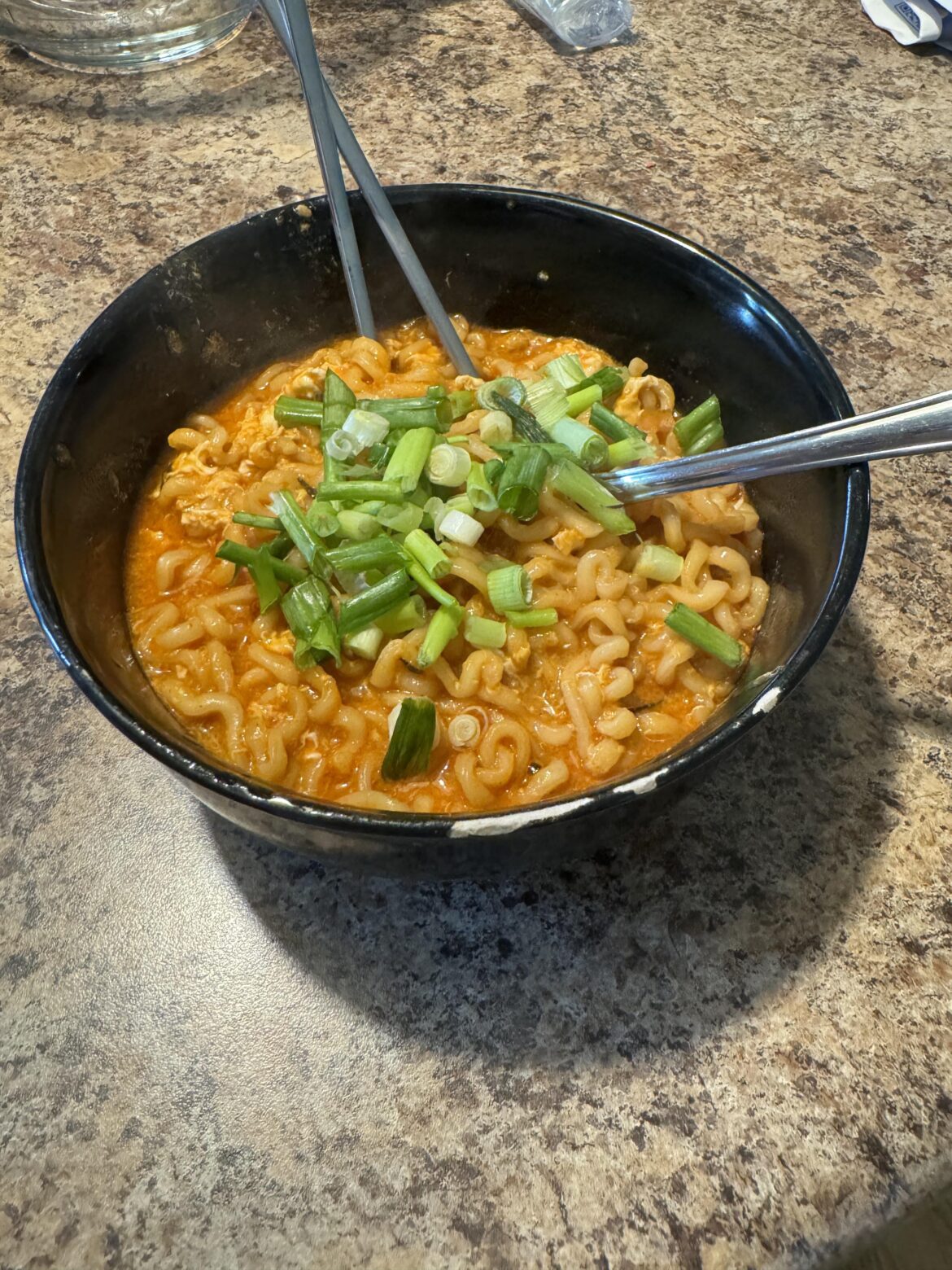 2x spicy with egg mixed in already and green onions. To burn away emotional pain!