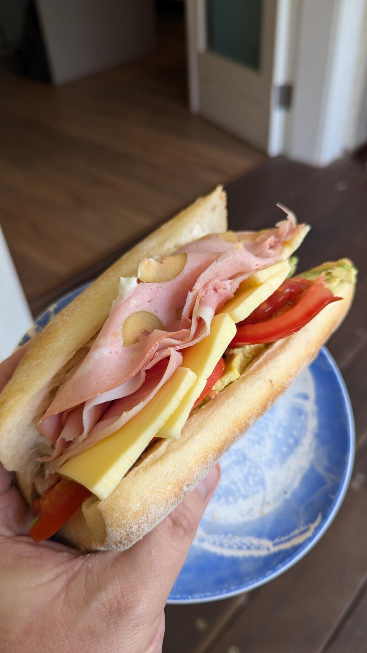 Home made classic: Mortadella & Ham Sandwich with Colby Cheese, Fresh Tomato, Avocado, and Mayo